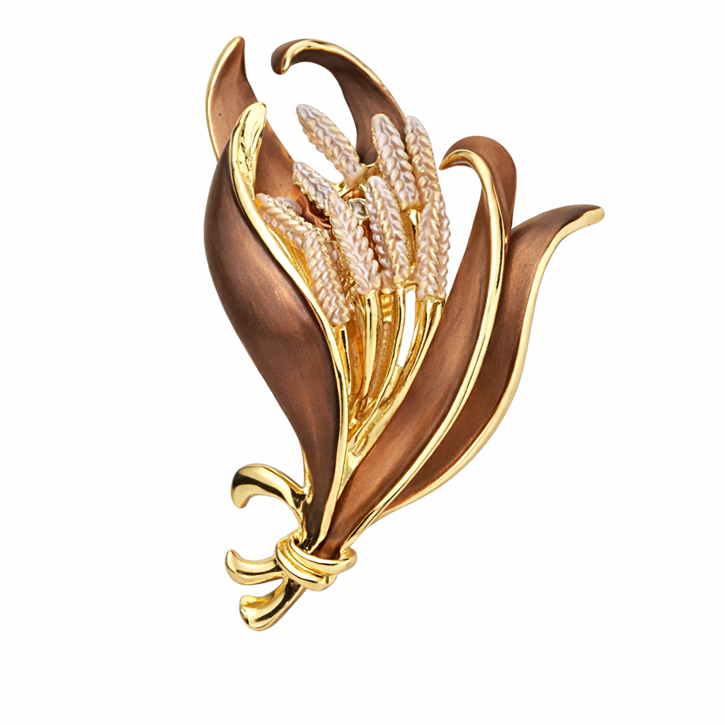 “Magneetbroche Gouden Oogst met sierlijke bladeren in bruin en goud, verfijnde aren als centraal detail.”