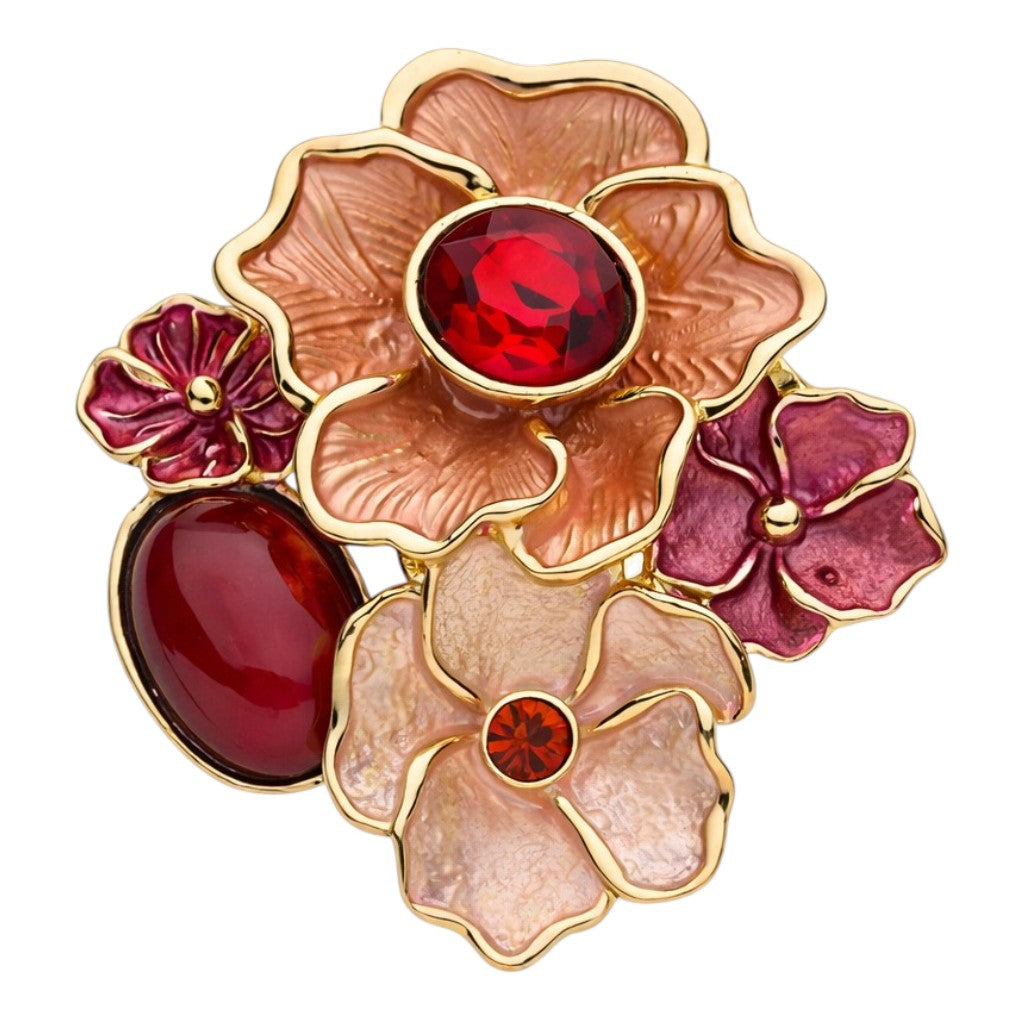 Elegante magneetbroche met bloemen in rood-, roze- en perziktinten, afgewerkt met goudkleurige details en fonkelende rode stenen. Een opvallende broche zonder speld die warmte en vrouwelijke charme uitstraalt.