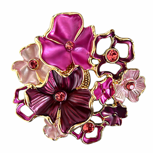 Magneetbroche Nr.18 Bloemenpracht met roze en paarse bloemen, fonkelende steendetails en elegante goudkleurige accenten.