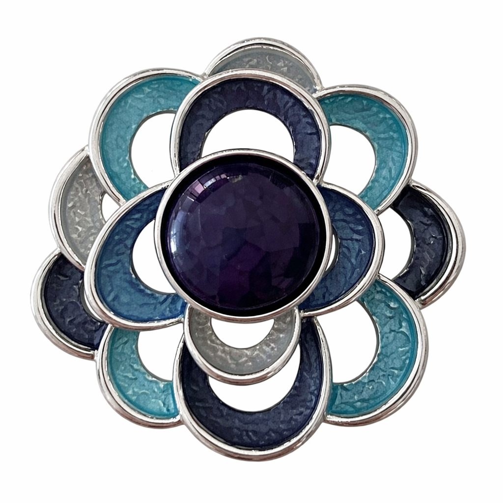 Magneetbroche Nr.48 Bloem Oceaanblauw met bloemvorm in blauw- en turquoise tinten, elegante damesbroche met zilverkleurige accenten.